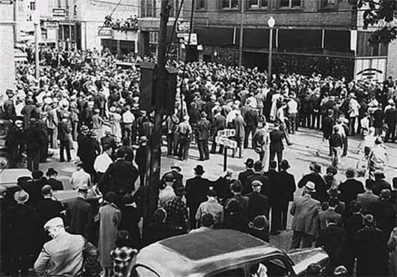 Crowd outside of  meeting at Teamsters Local 544 at the corner of Third Street North and Plymouth North, Minneapolis (circa 1936).